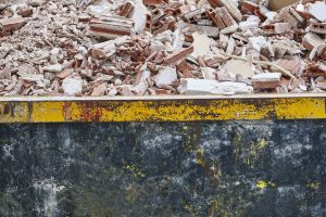 Removal of debris. Construction waste. Building demolition. Devastation background